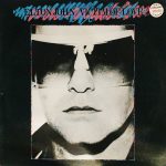 ELTON JOHN – VICTIM OF LOVE